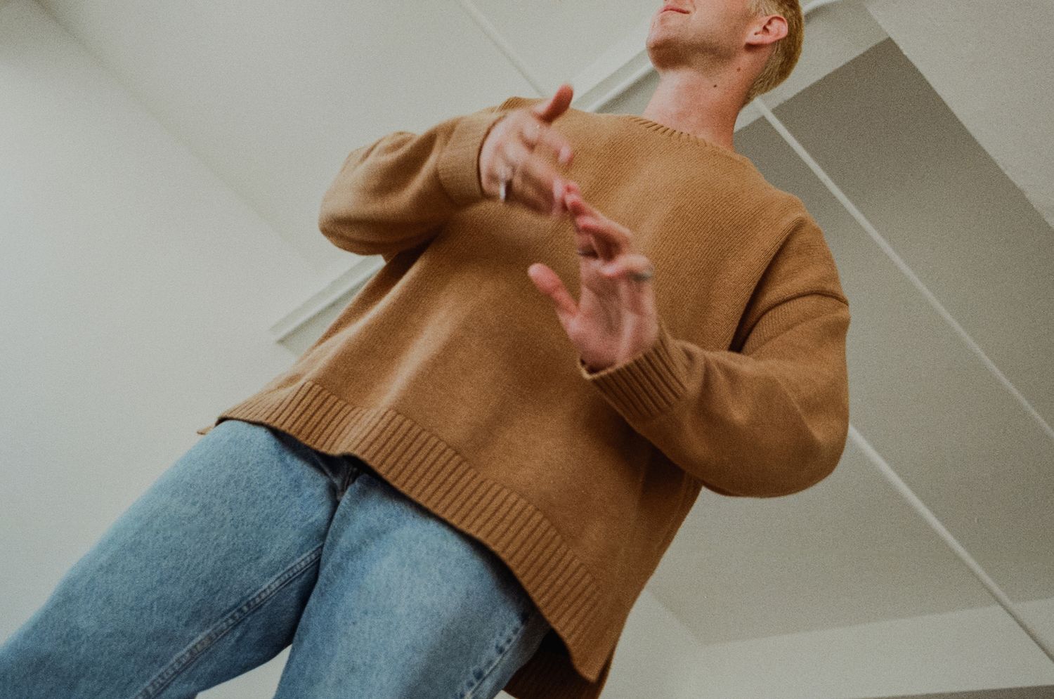 Studio brand sweater detail of man in downtown Los Angeles