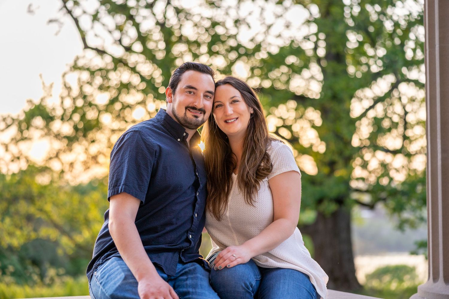 Romantic outdoor engagement photos in a park during golden hour.