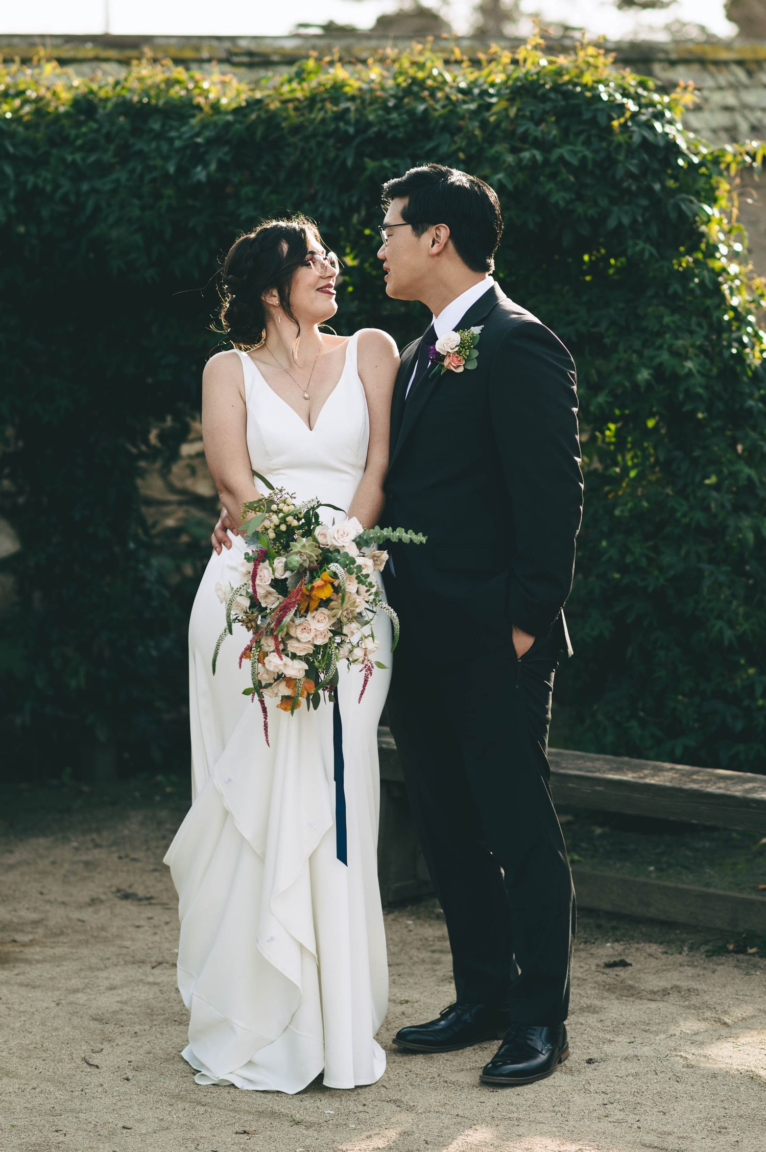 Bride and groom, in the garden at the barns at cooper molera in Monterey