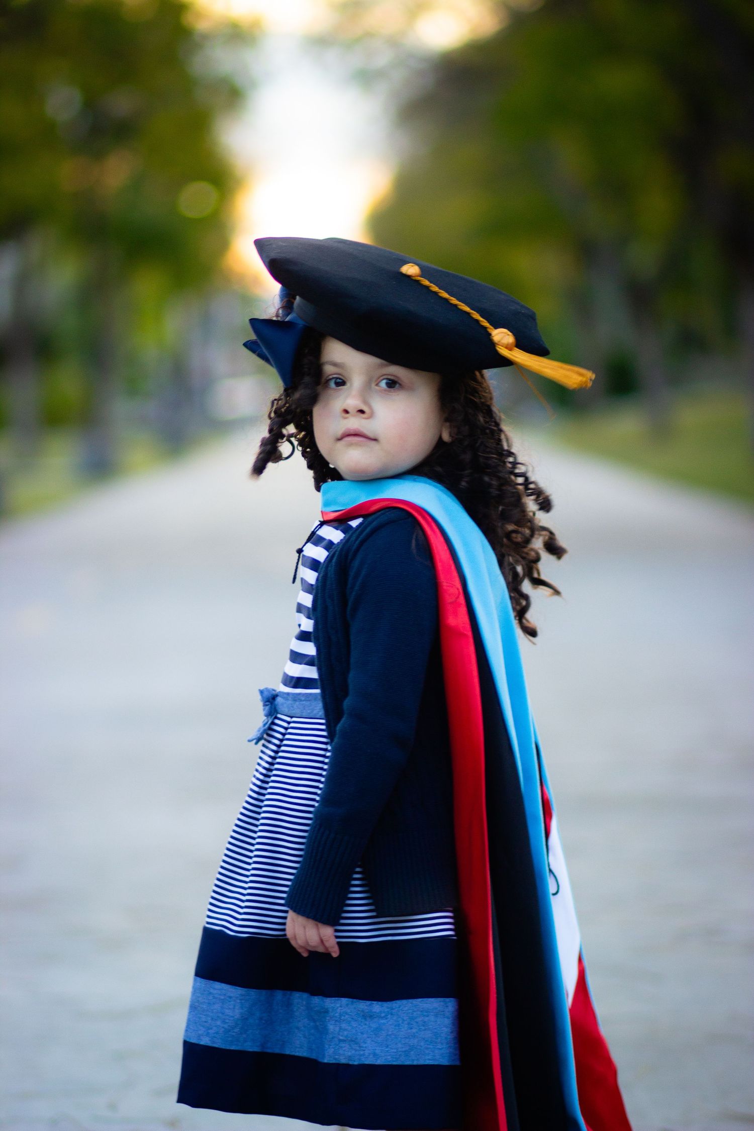 Graduation photoshoot shot at CSUN, California State University of Northridge. Graduate's daughter photographed with style and intent.