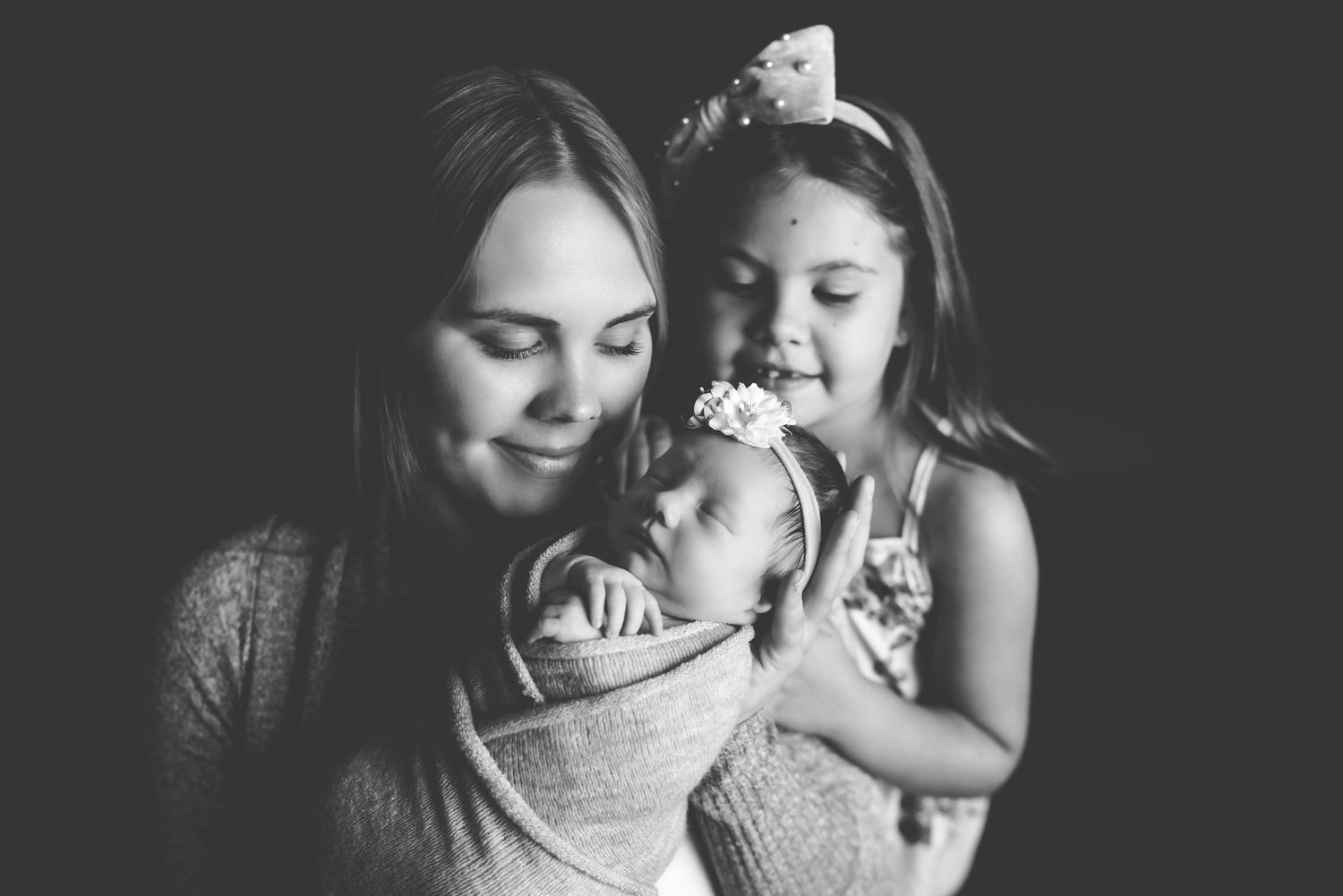 Intimate black and white portrait session capturing tender family moments.