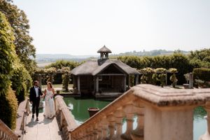 View of the lake and boat house at Euridge Manor, luxury Cotswolds wedding venue