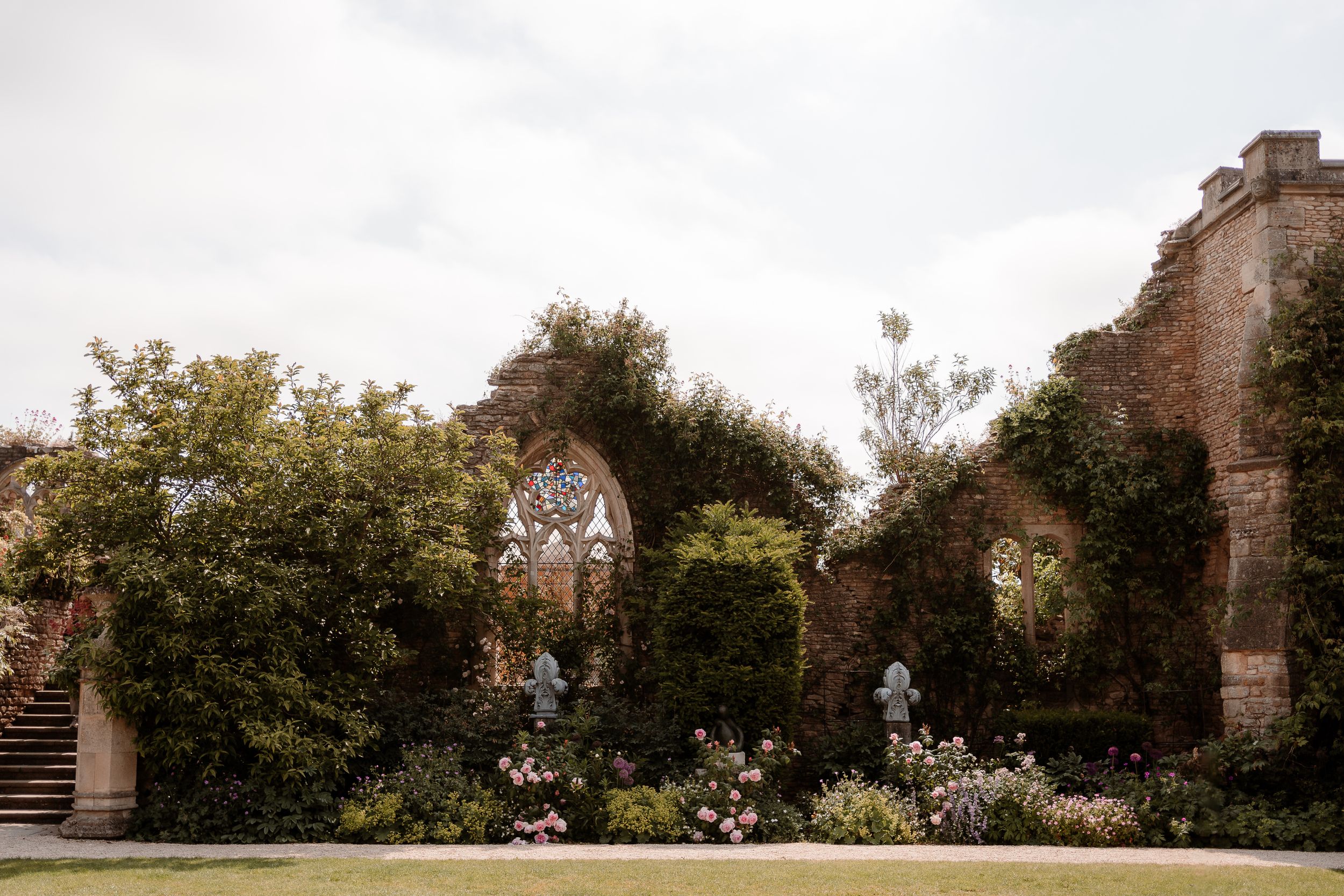 A view of the garden and ruins at Euridge Manor, luxury Cotswolds wedding venue