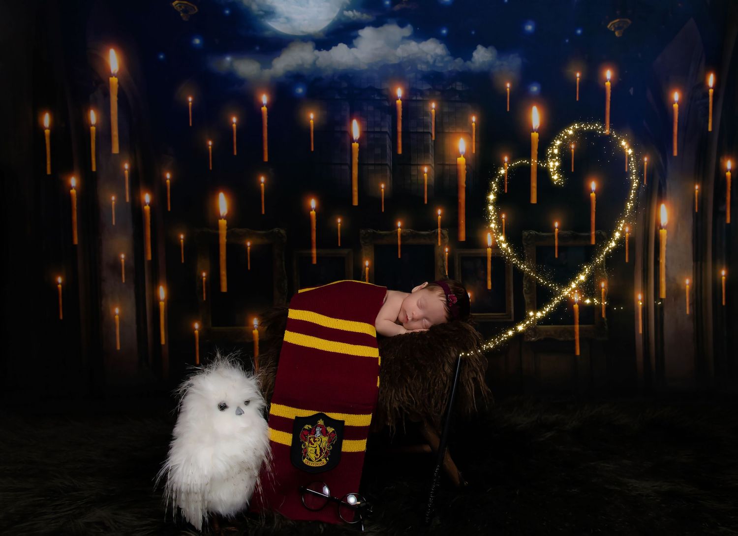 Magical Harry Potter themed newborn photo with floating candles and white owl against night sky.
