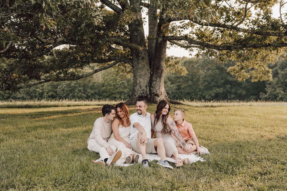 family under big oak tree