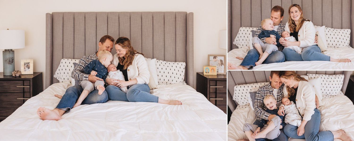 Cozy lifestyle family photography session on a plush gray upholstered bed.