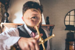 Bartender mixing cocktail with dramatic lighting and shallow depth of field.