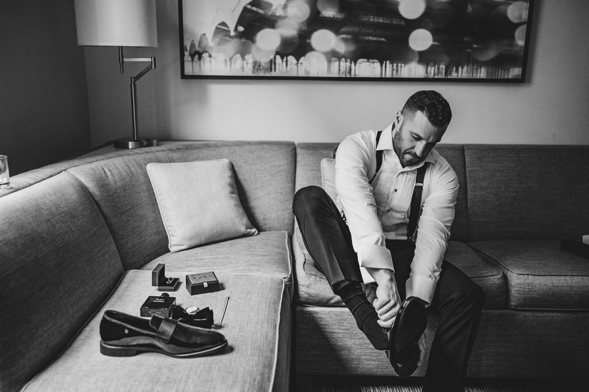 Black and white images capturing pre-wedding moments in a contemporary space.