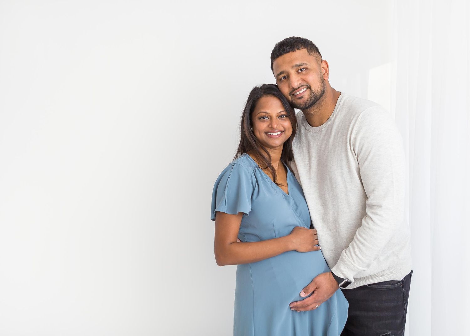 expectant parents, blue dress, smiling indian couple, family newborn photoshoot, studio photography, infant chattanooga