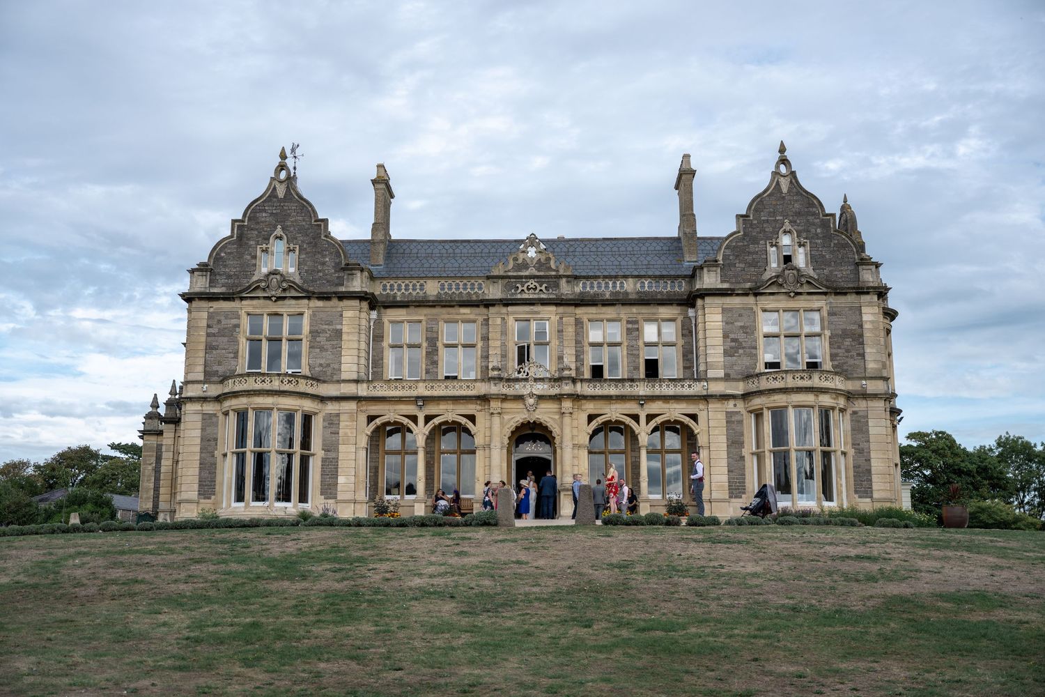 Grand Scottish baronial manor house with ornate stonework and Gothic architectural details.