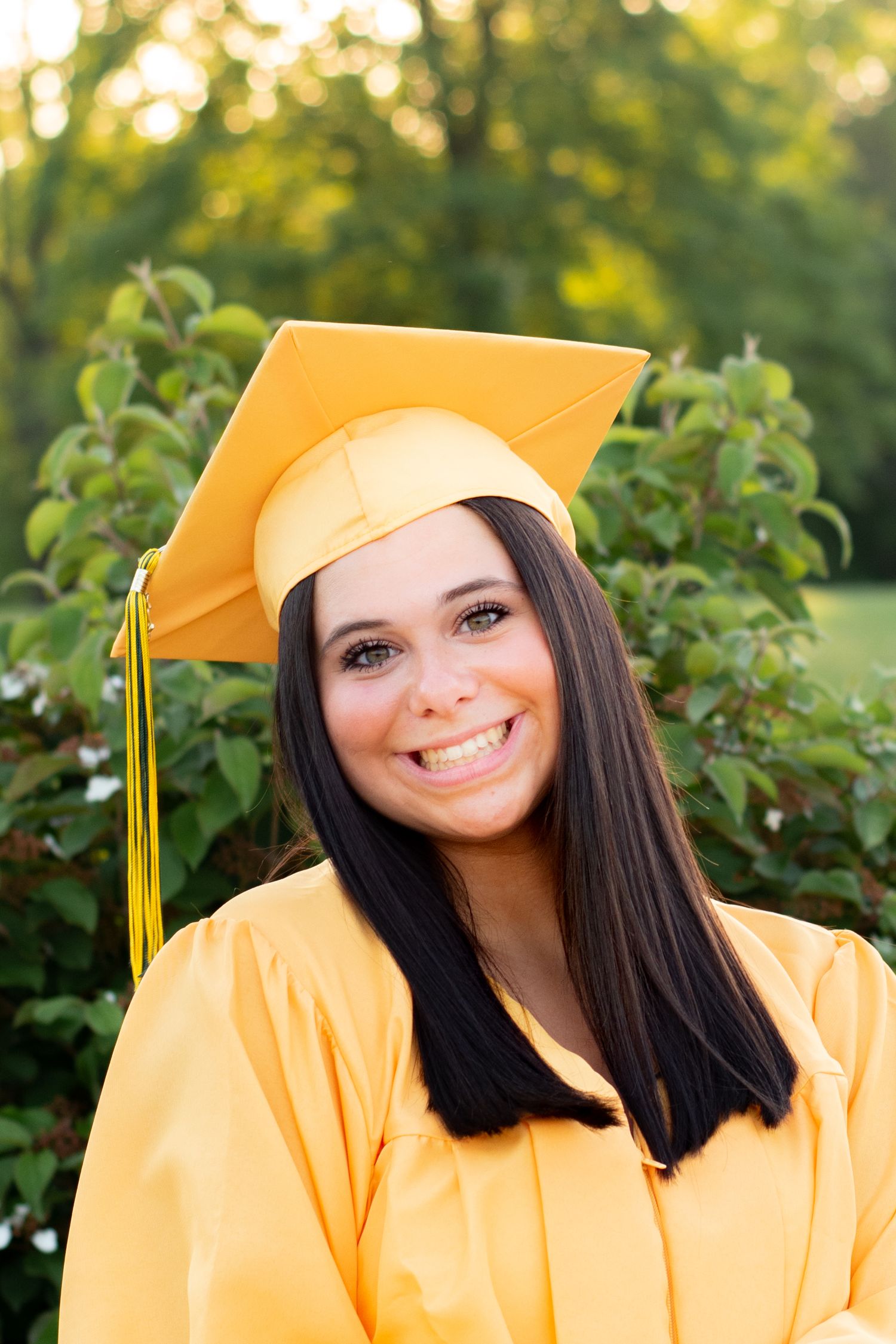 high school girl cap and gown portrait