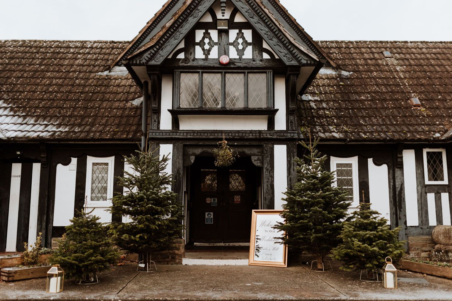 Outdoor christmas tree set up for a wedding enterance.