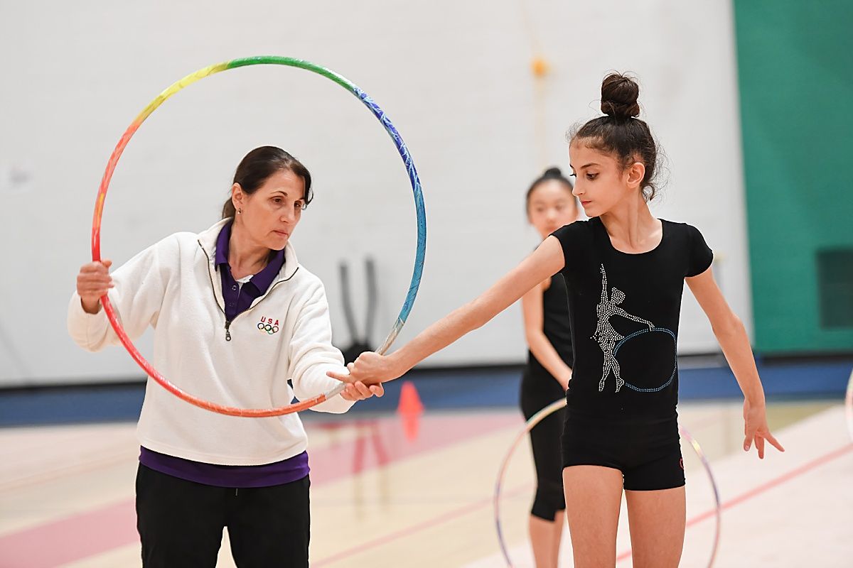 Galina Burns teaching rhythmic gymnast hoop