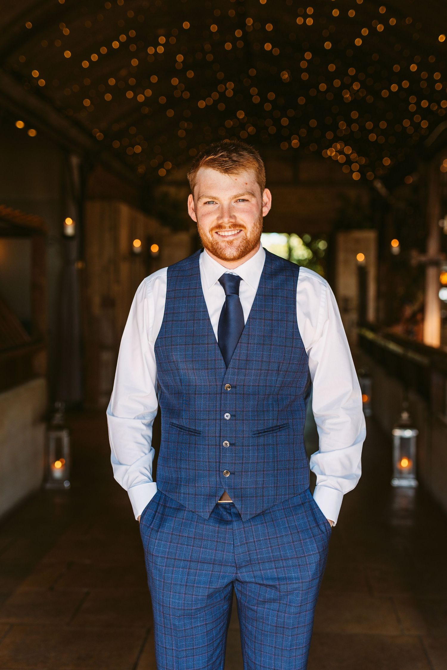 Handsome ginger haired groom portrait Stone Barn Wedding Venue Cheltenham The Cotswolds