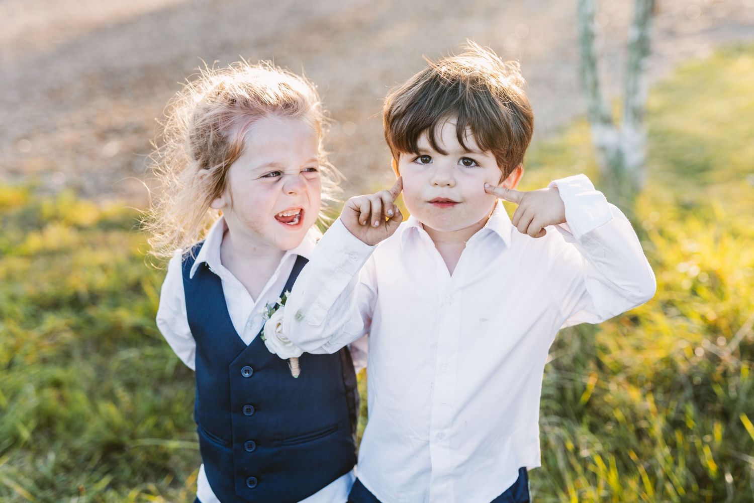 Cool kids at Stone Barn wedding venue wearing waistcoat and hair tied back