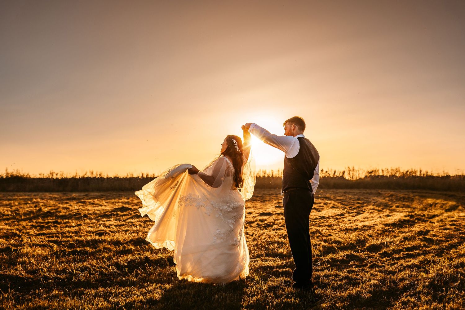 magical Bride and Groom golden hour sunset dancing Stone Barn The Cotswolds looks like film painting