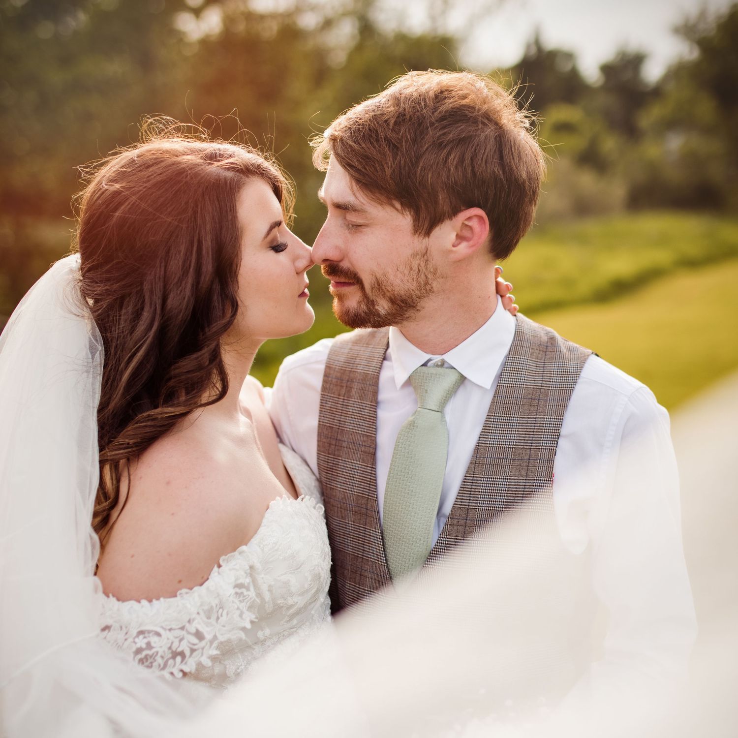Romantic wedding portrait with soft lighting and intimate expressions.