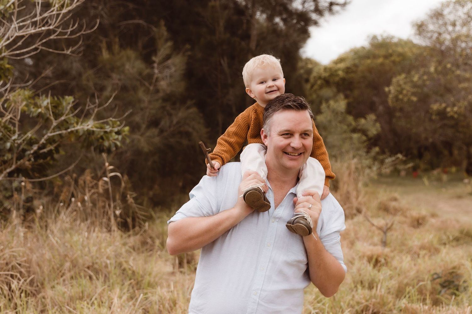 Father taking his son for a shoulder ride during a Brisbane family photo shoot