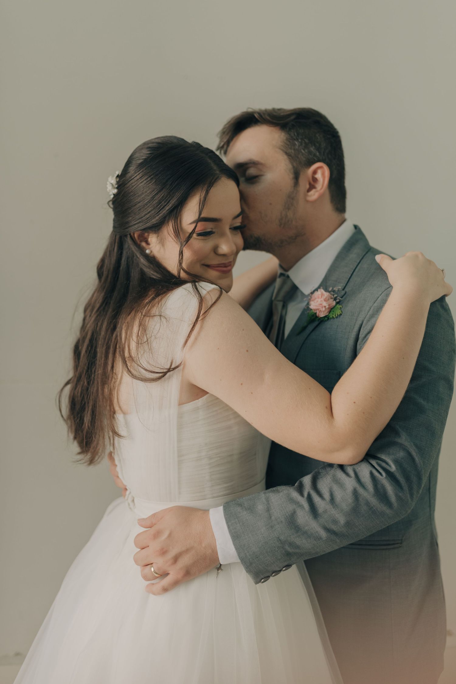 Romantic wedding portrait capturing intimate moment between newlyweds.