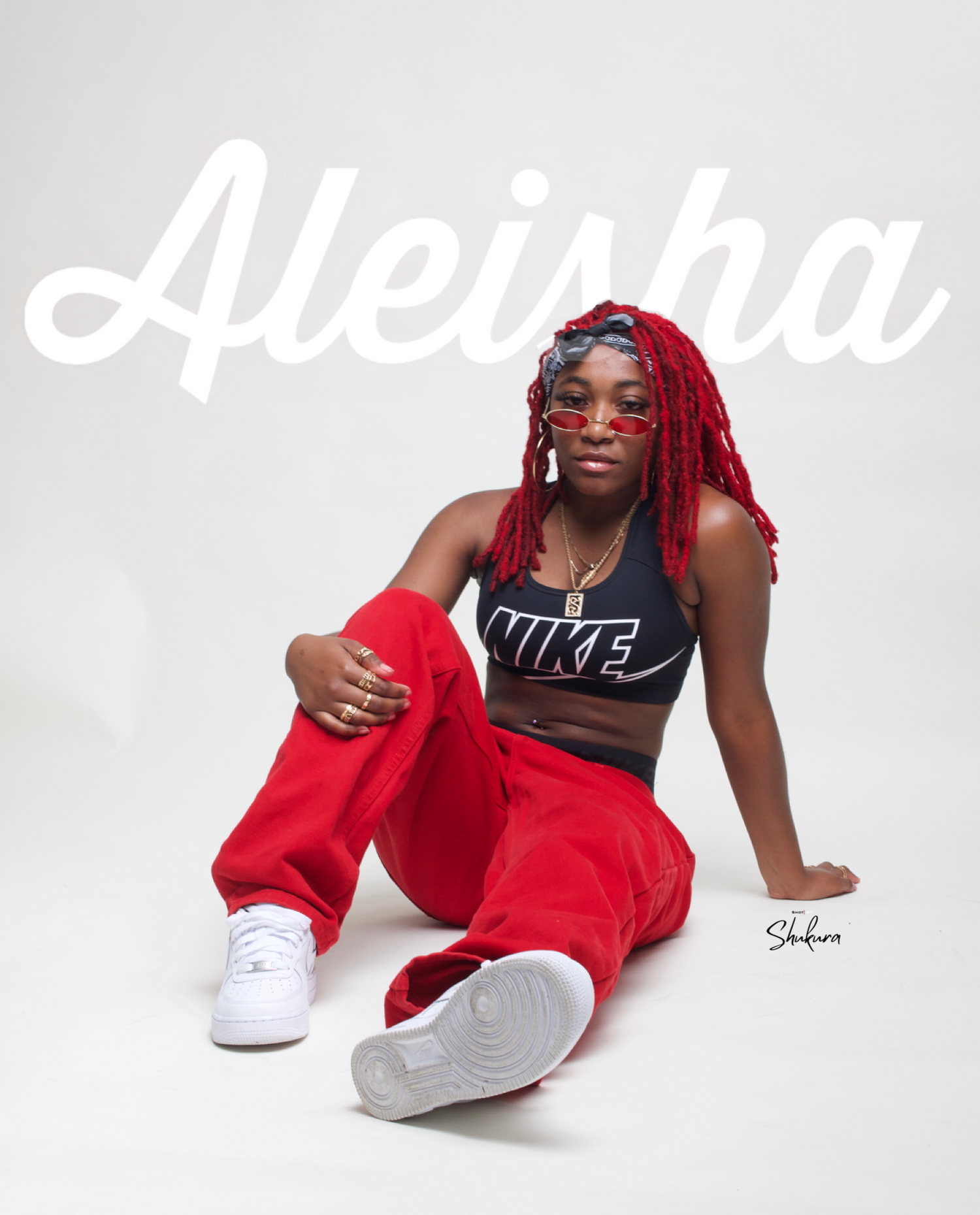 Athletic model in red and black Nike outfit poses against white background with text overlay.