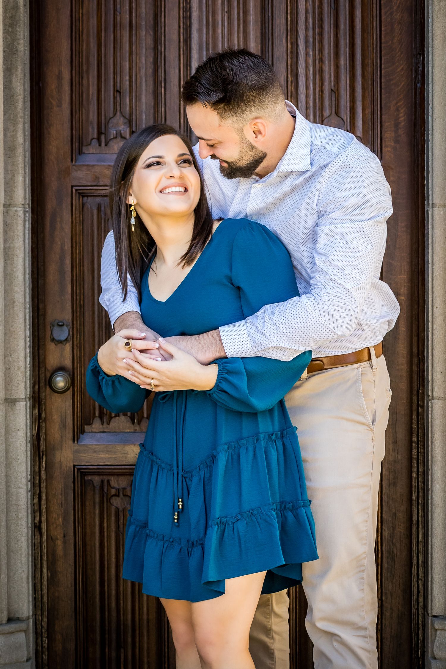 a couple shares a playful hug
