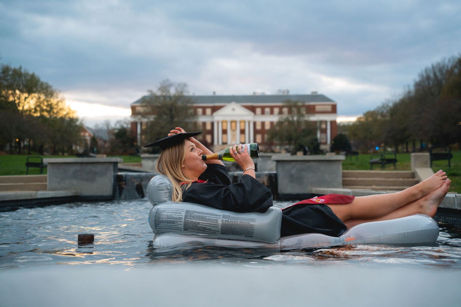 A series of images showing inflatable boats on a lake near buildings.