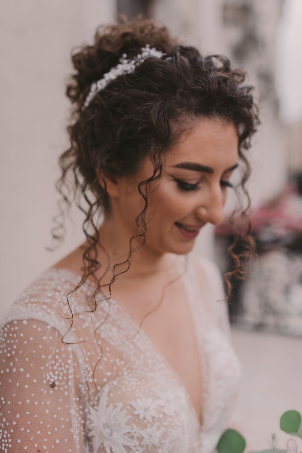Detail shots of bride's lace dress and delicate pearl embellishments.