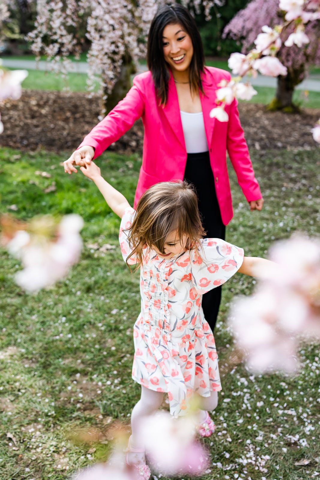 Mom dancing with daughter at the Seattle Arboretum