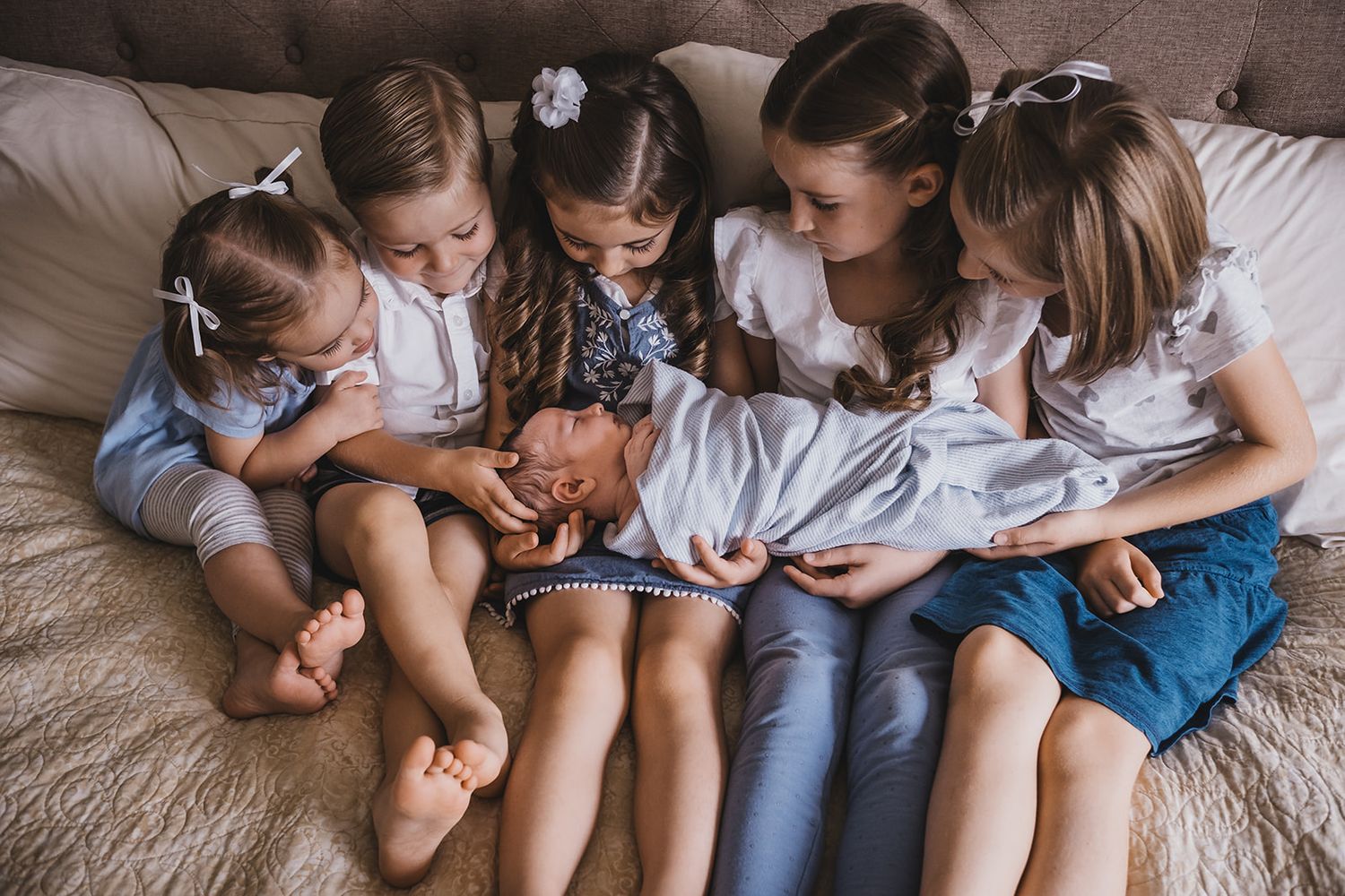 kids with a newborn baby at home in Layton, Utah, Davis County.