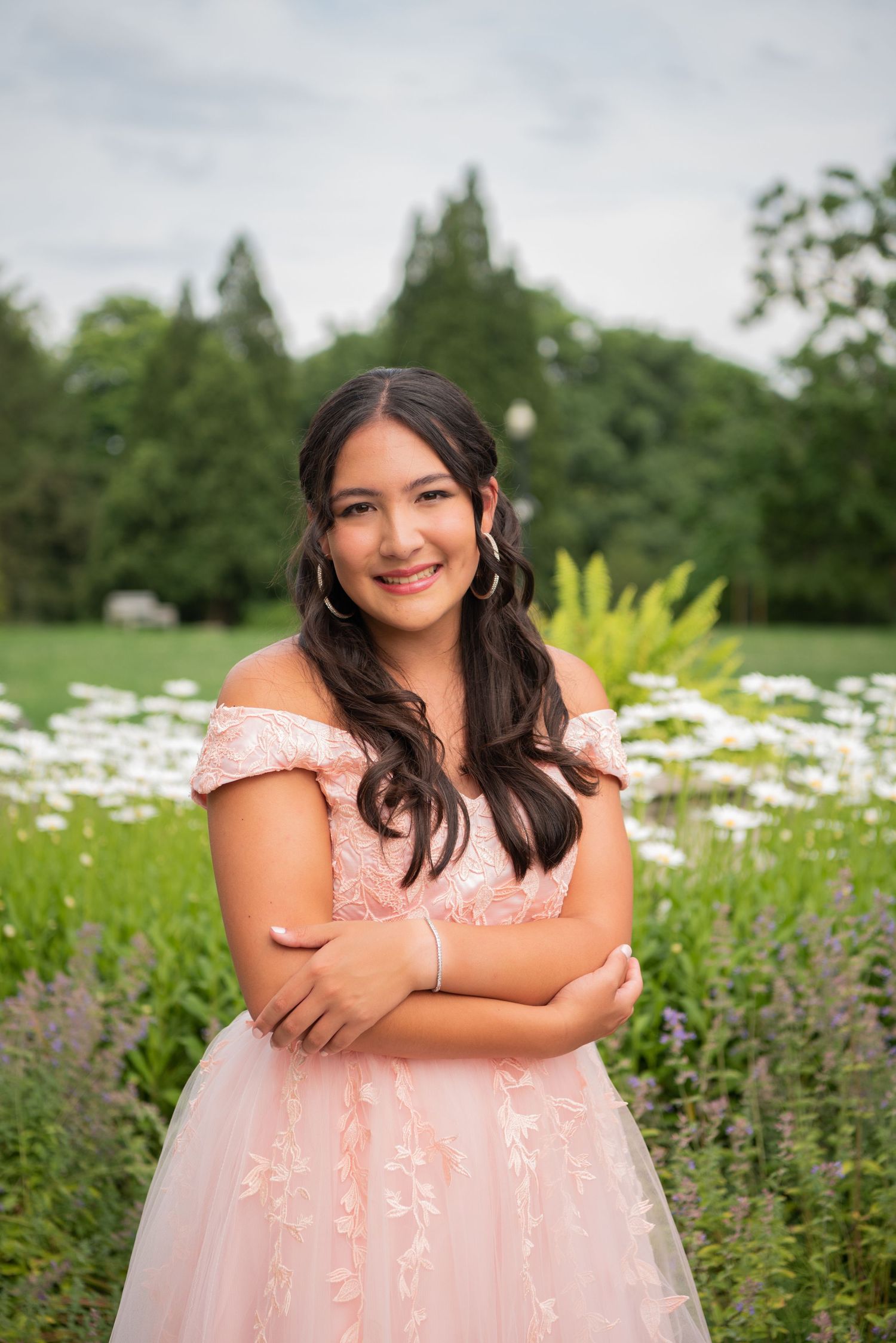 portrait of girl in pink gown in gardens at mellon park