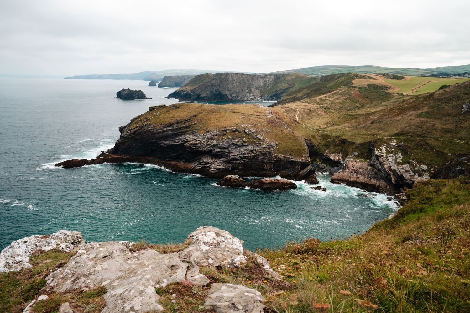 Decorative image of the Cornish coastline.