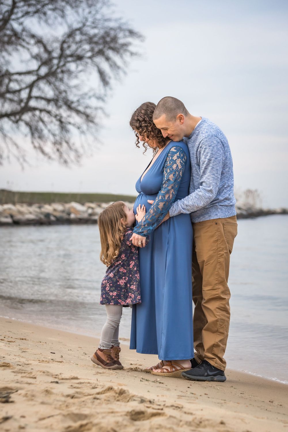 Family Maternity photo on the beach at Sandy Point State Park. Annapolis family photographer. Annapolis maternity photography