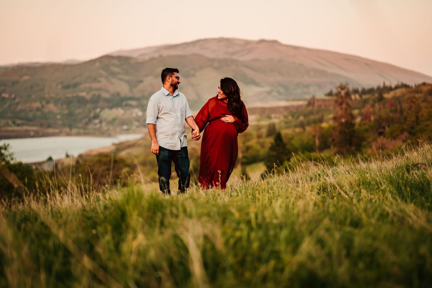 Couple walk together in a field