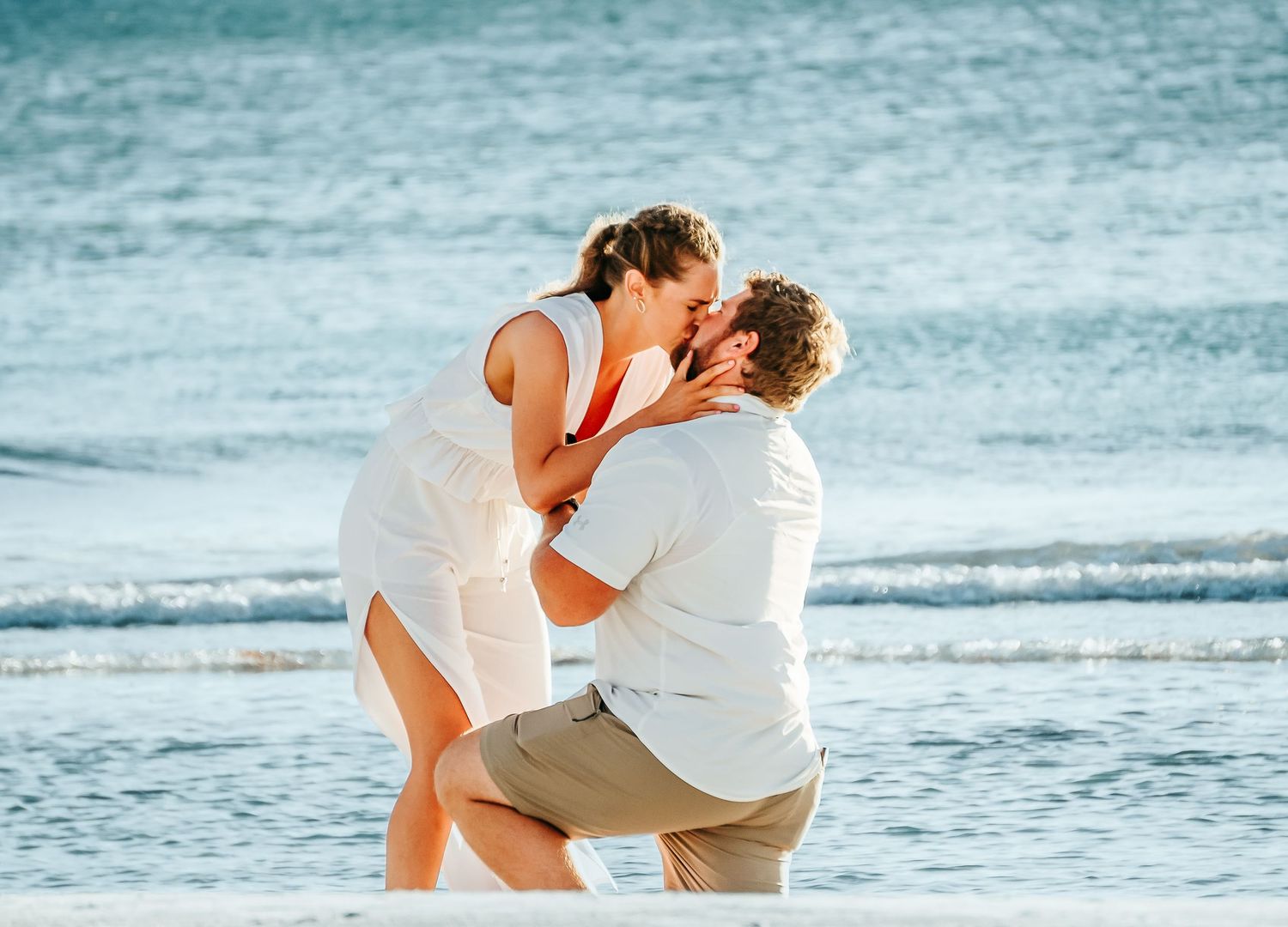 Outdoor Proposal Session at Indian Rocks Beach in Indian Rocks, FL; Man and woman kissing after proposal on beach