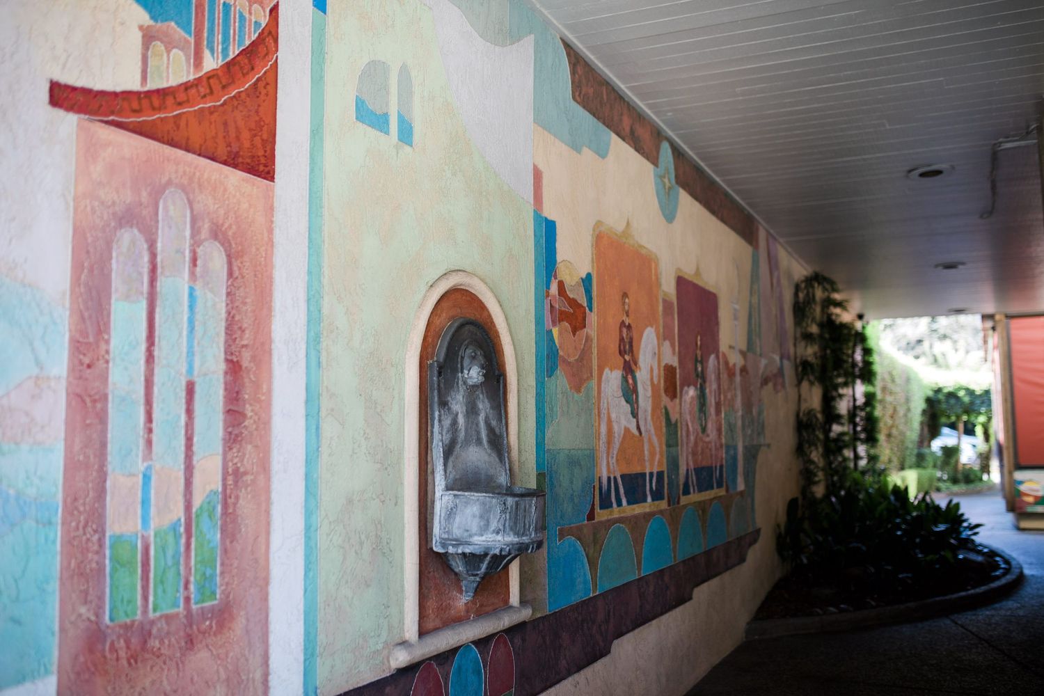 A colorful mural in between buildings.