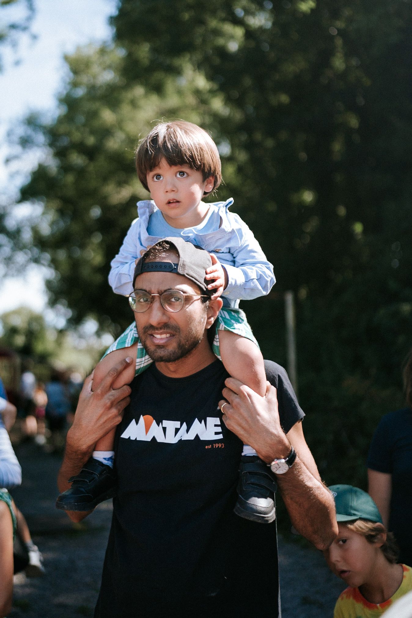 Southeast London Wedding and family photographer son on fathers shoulders