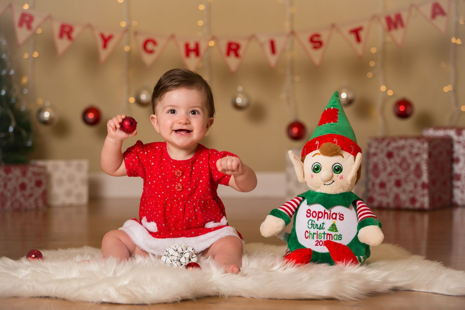 Christmas photo of baby girl in red dress