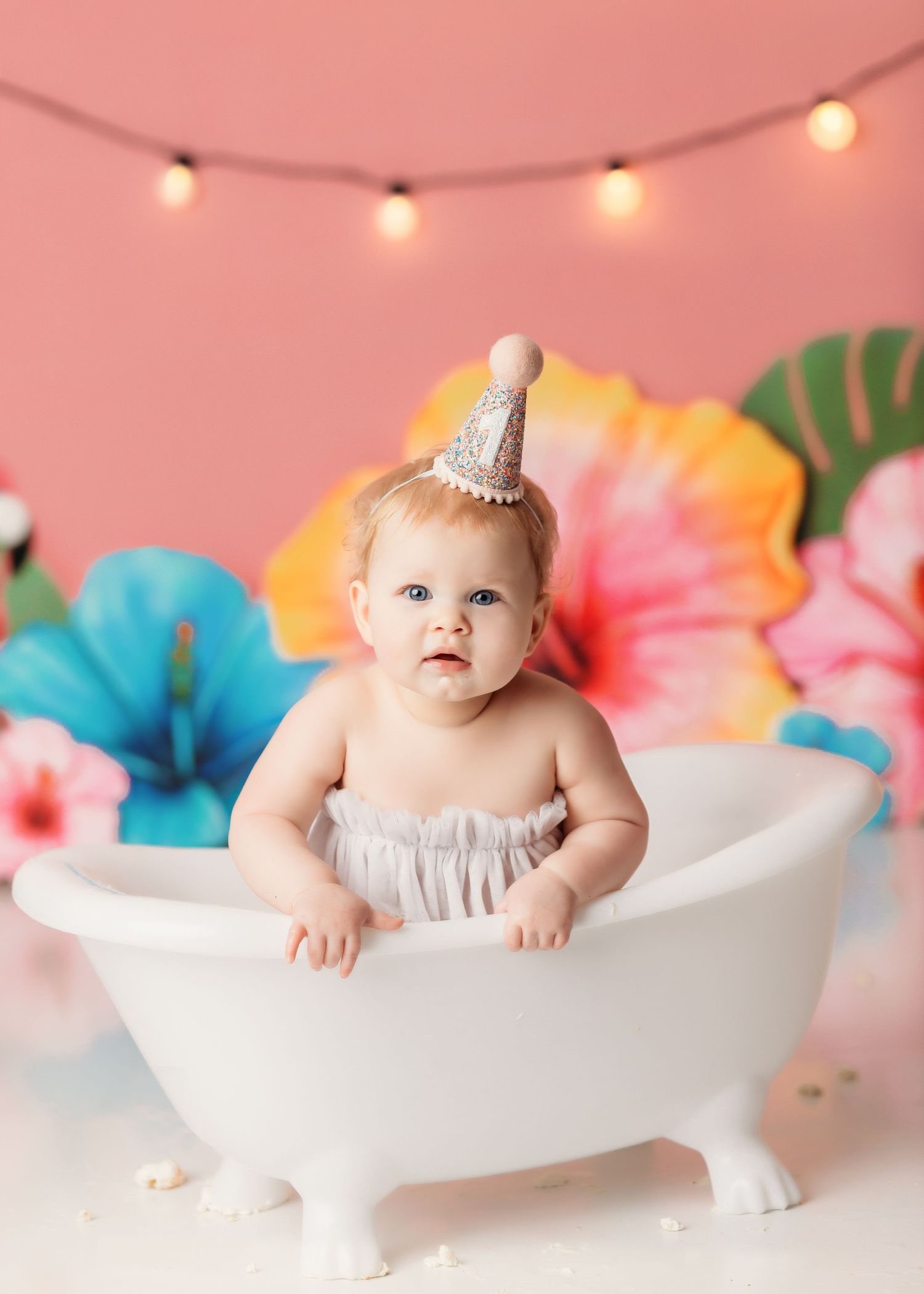 baby girl in splash bath after her tropical theme cake smash in tulsa ok