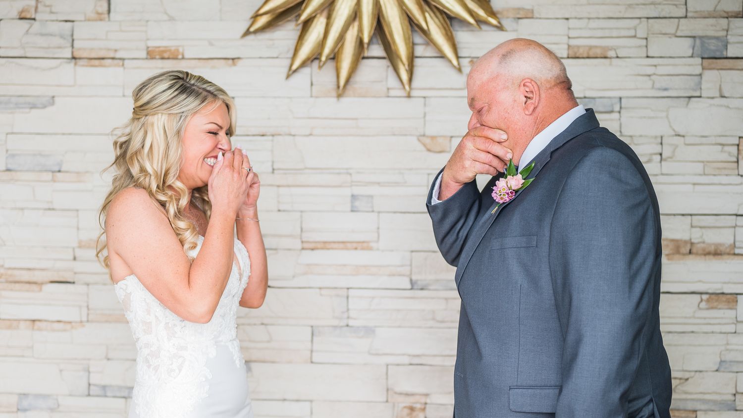 Emotional first look: Bride and her father sharing tears of joy.
