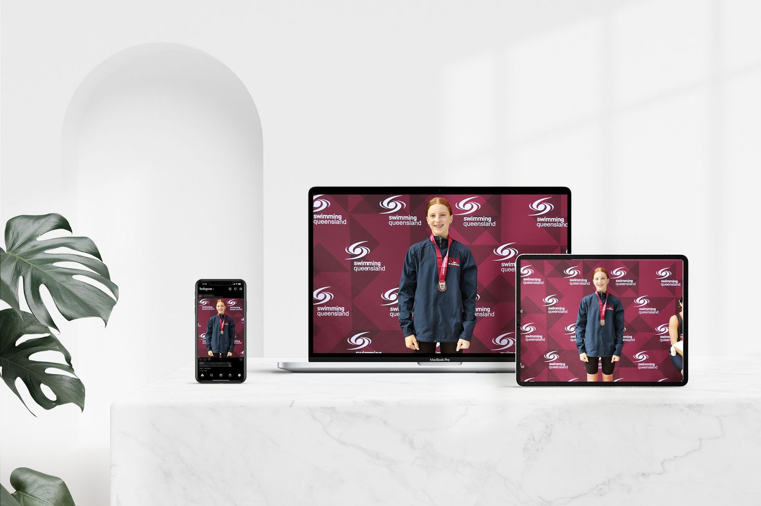 Responsive web design mockup showing athlete photo across multiple device screens.