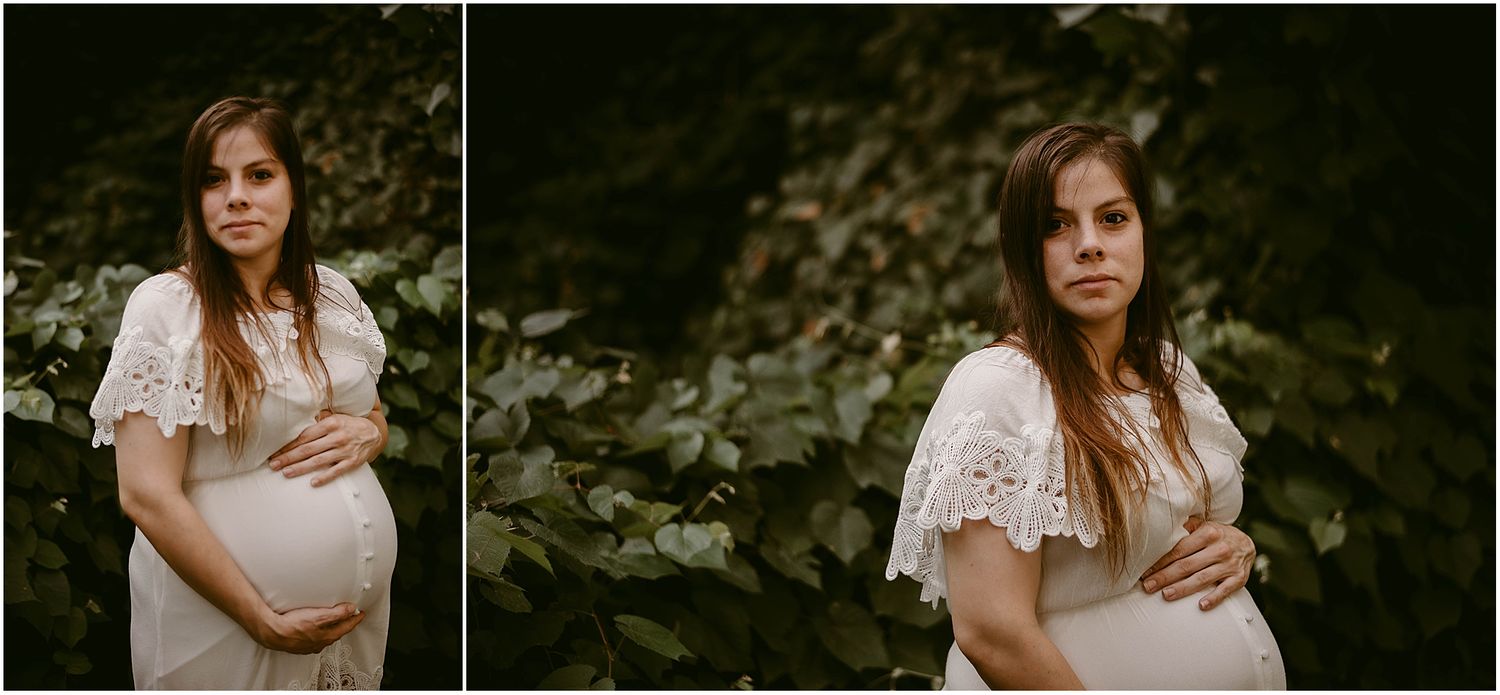 Close-up maternity portraits in white lace dress with natural foliage backdrop.
