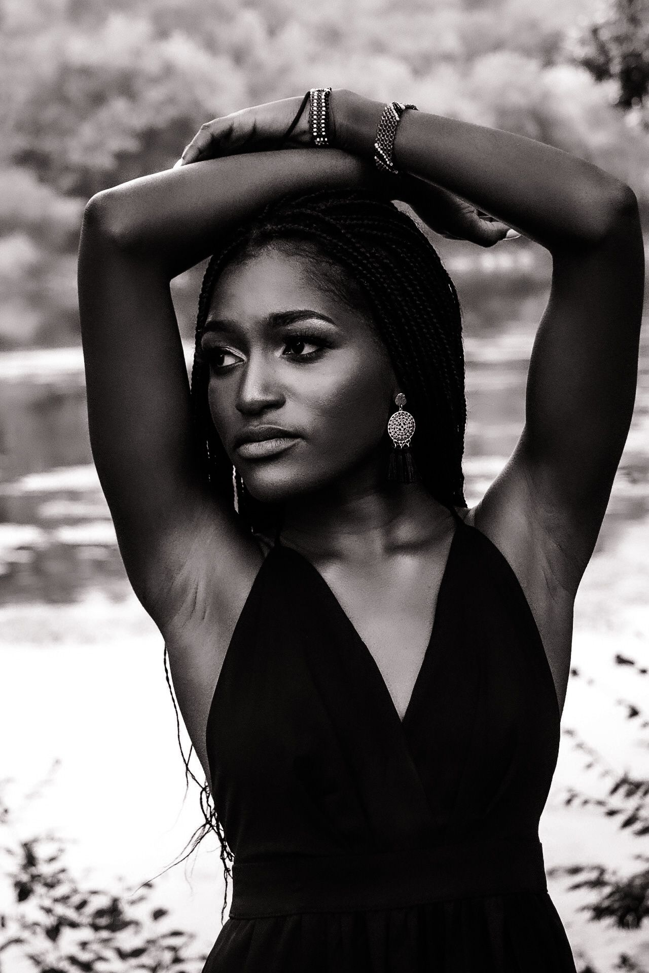 Black and white portrait series showing elegant poses with raised arms.