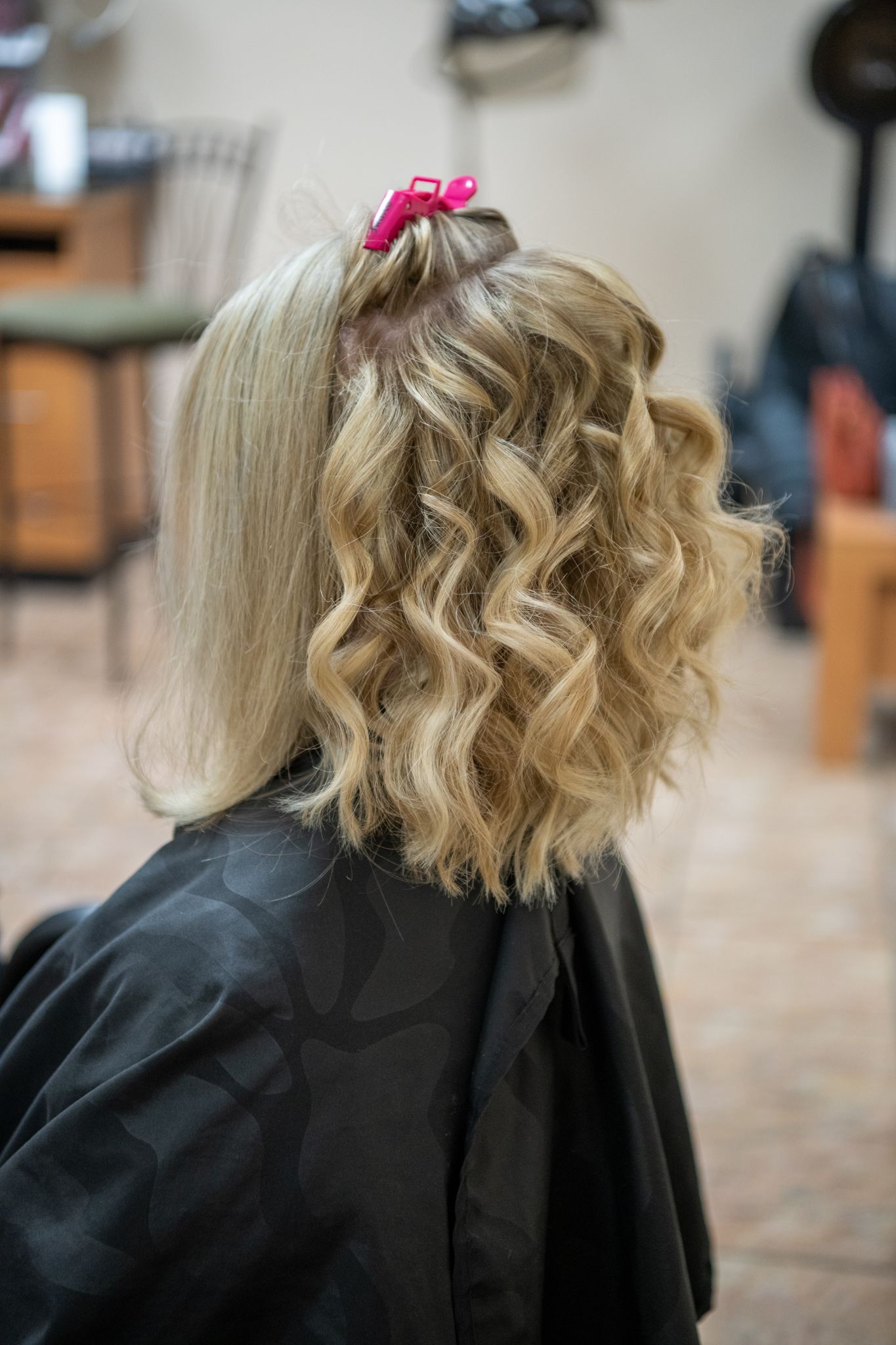 Side image of model with hair partly curled for a photoshoot with Kathleen Murphy Photography in Rochester, Minnesota.