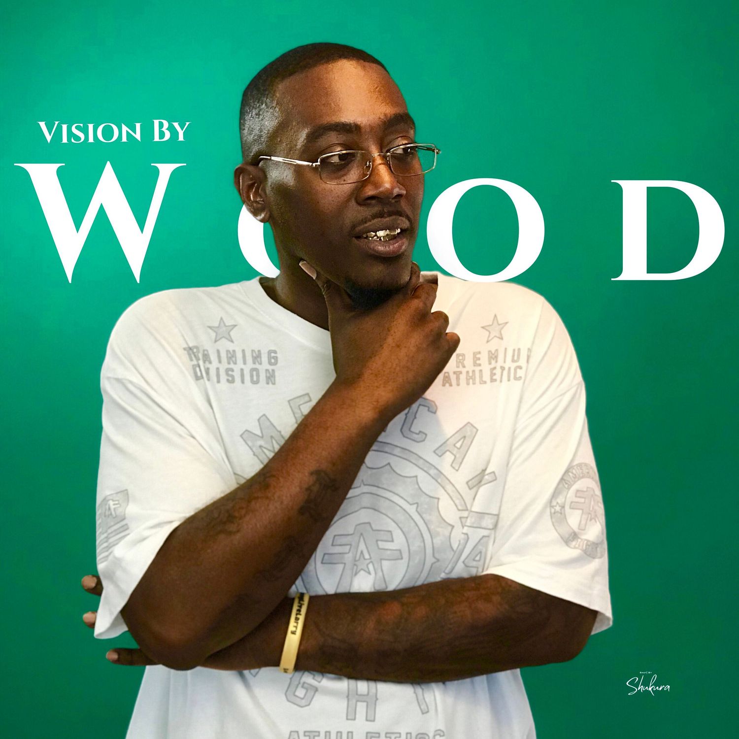 Portrait against green background with 'Vision by Wood' text overlay.
