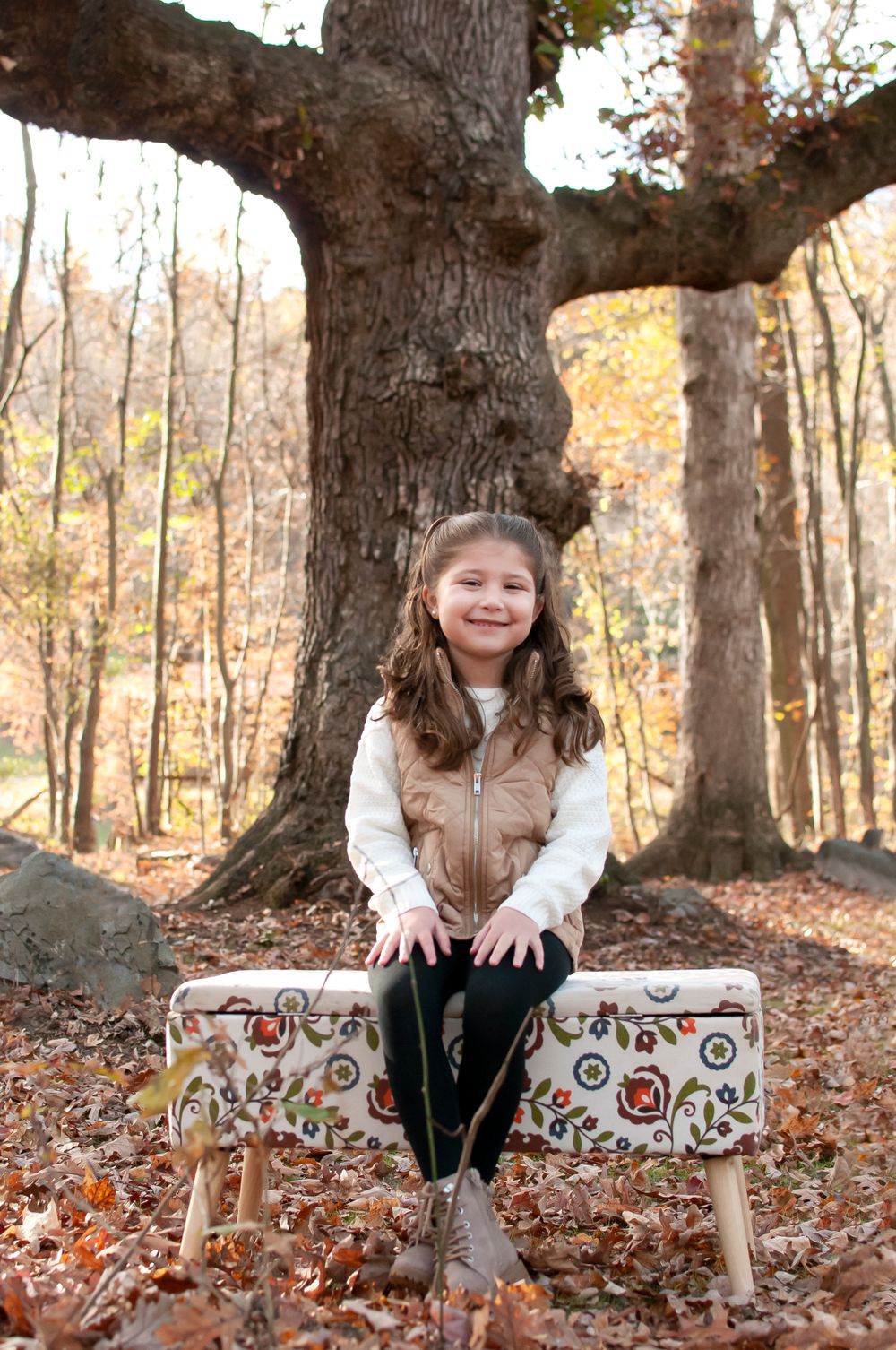 photo of young girl on bench fall