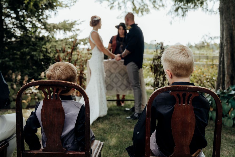 Bride's children watching her mother get married.
