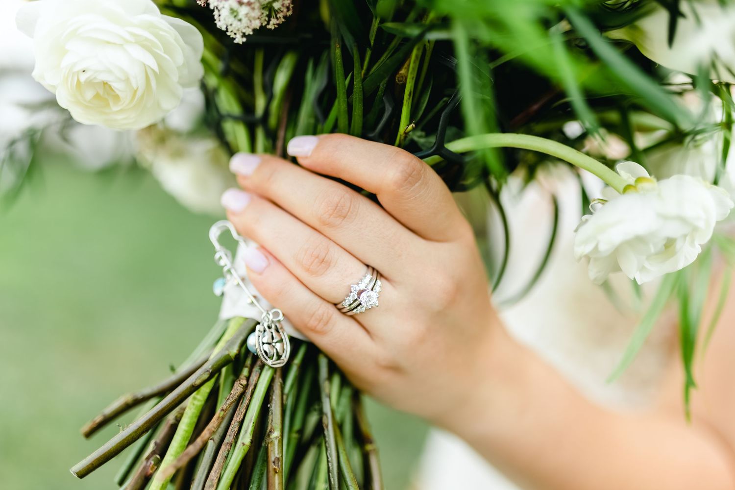 Close-up of white roses and floral arrangements with delicate greenery.