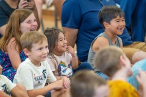 Group of students smiling and enjoying themselves during a school event.