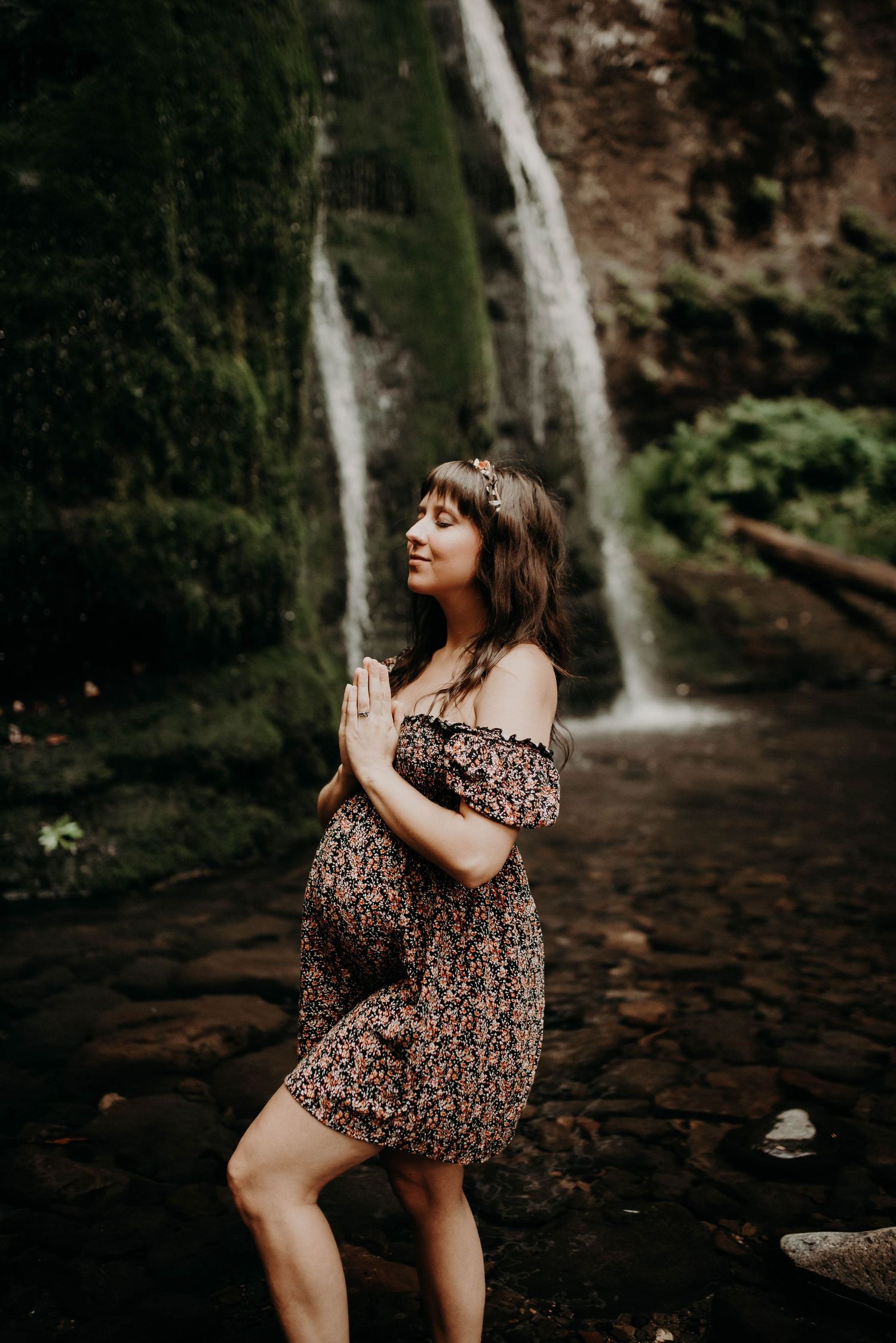 Pregnant woman at waterfall
