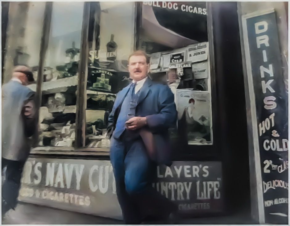 Colorized photo of person standing outside vintage tobacco shop with cigarette advertisements.